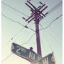Power lines, Street signs.