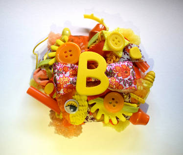 orange and yellow ''B'' initial brooch