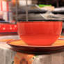 Orange ceramic bowl and a plate