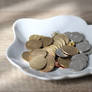 Romanian coins in a ceramic bowl