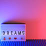 Press a button with text Dreams