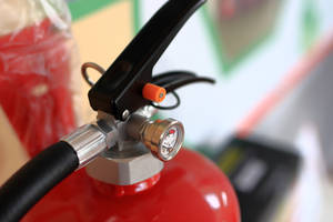 Photo close-up red fire extinguisher