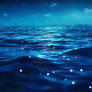 deep blue moonlit ocean at night with calm waves