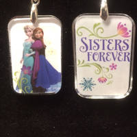 Two sided Elsa and Anna charm