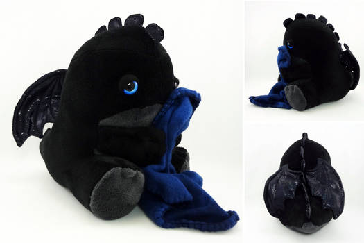 Sleepy blue eyed black dragon