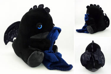 Sleepy blue eyed black dragon