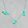 Little blue green chameleons on a chain