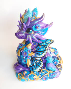 Figurine butterfly dragon with bird