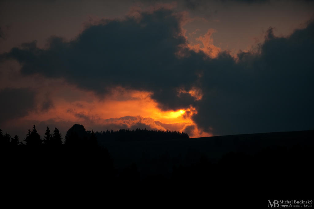 Sunny window in heavy clouds