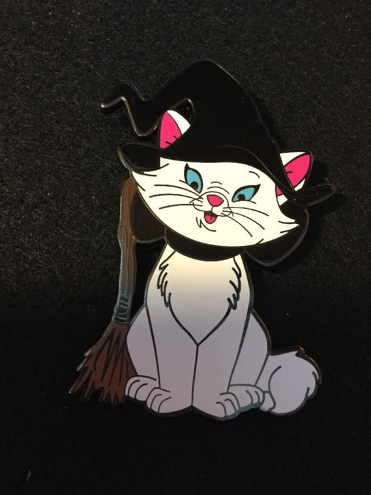 Marie the witch kitten with a broomstick