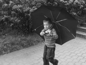 a boy with an umbrella