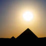 silhouette - pyramid and sun