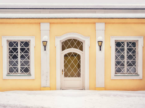 2 windows, a door, 2 lamps and some snow