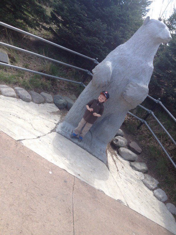 Jake and a polar bear statue at the zoo