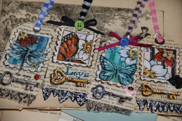 Altered tag set with insects and Steampunk flowers