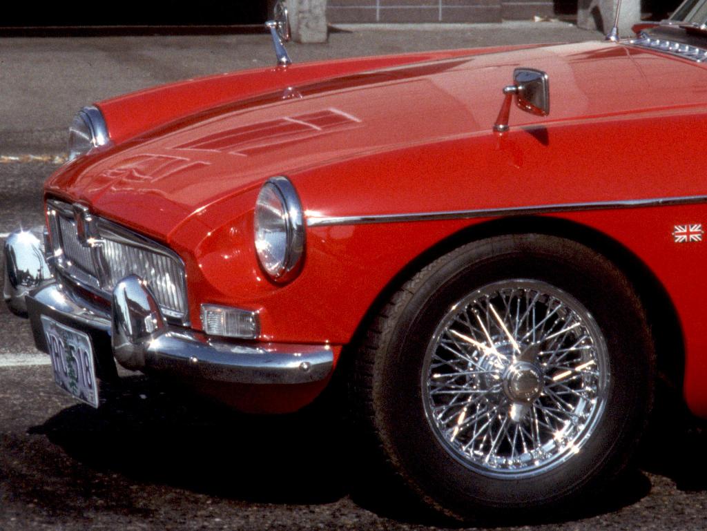 little red british car by poofygoof