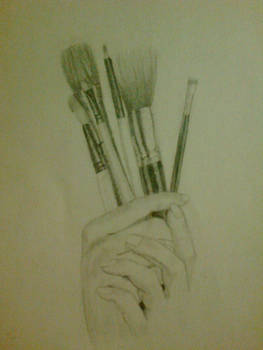 Hands With Makeup Brushes