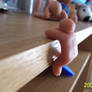 Clay Man climbing desk shelve