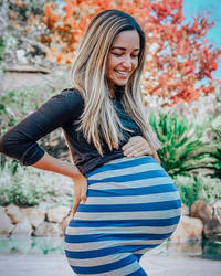 huge pregnant belly in blue and white