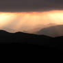 Stormy mountain sunset