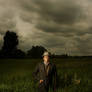 Guy in a Field. in a suit. soo