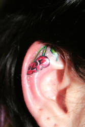 Cherry Ear Skull Tattoo