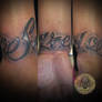 chicano lettering tattoo
