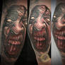Demon face tattoo