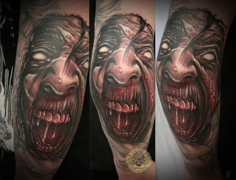 Demon face tattoo