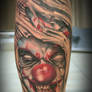 Joker face out of the skin tat