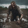 Zombie Crawling Through Mud