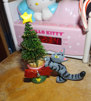 Kitty climbing christmas  tree