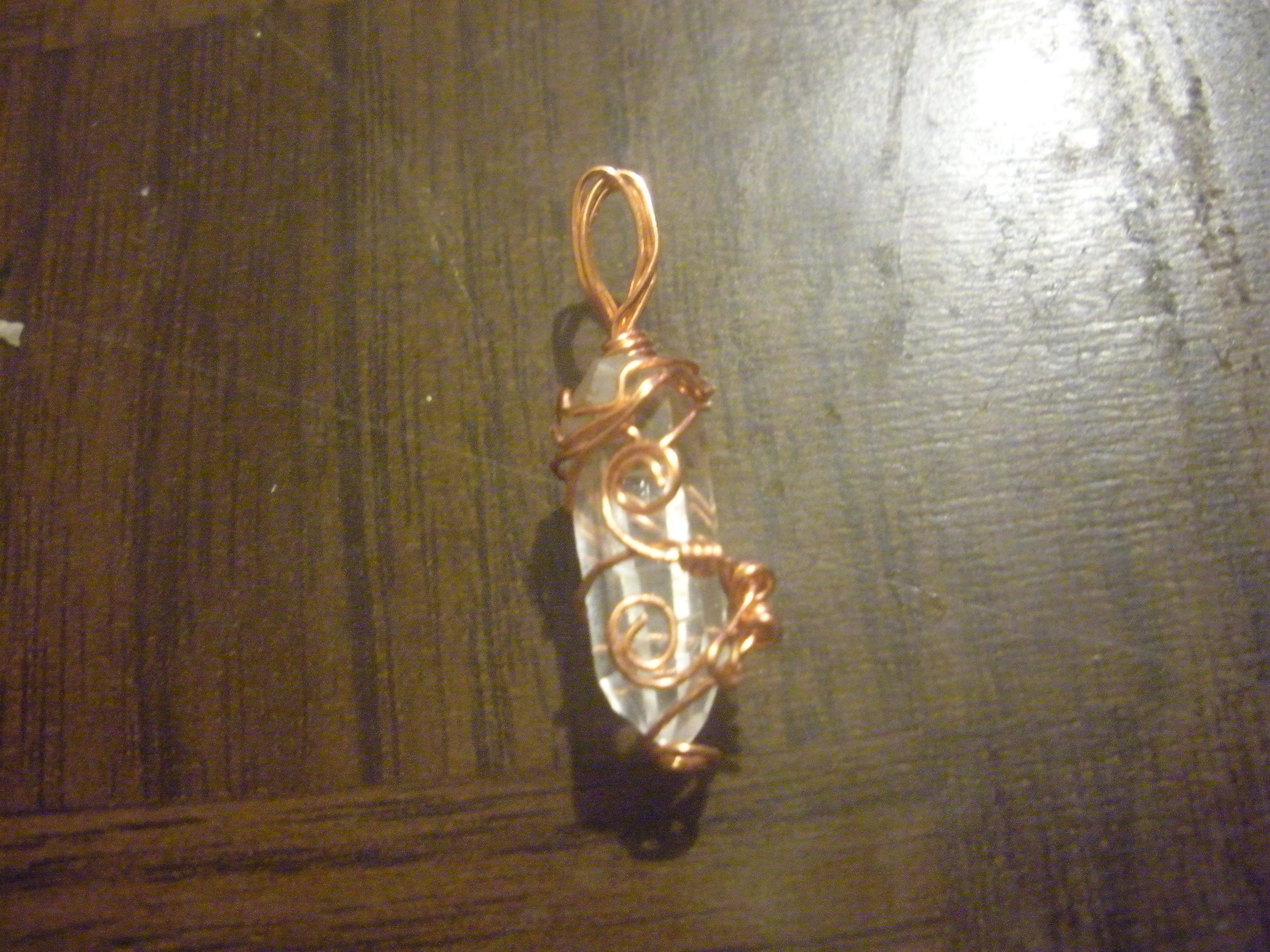 small copper wire wrapped crystal