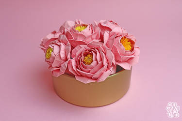 Pink paper peonies in a tin holder