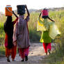 Girls carrying water..