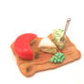 Miniature dollhouse, plate with cheese and grapes