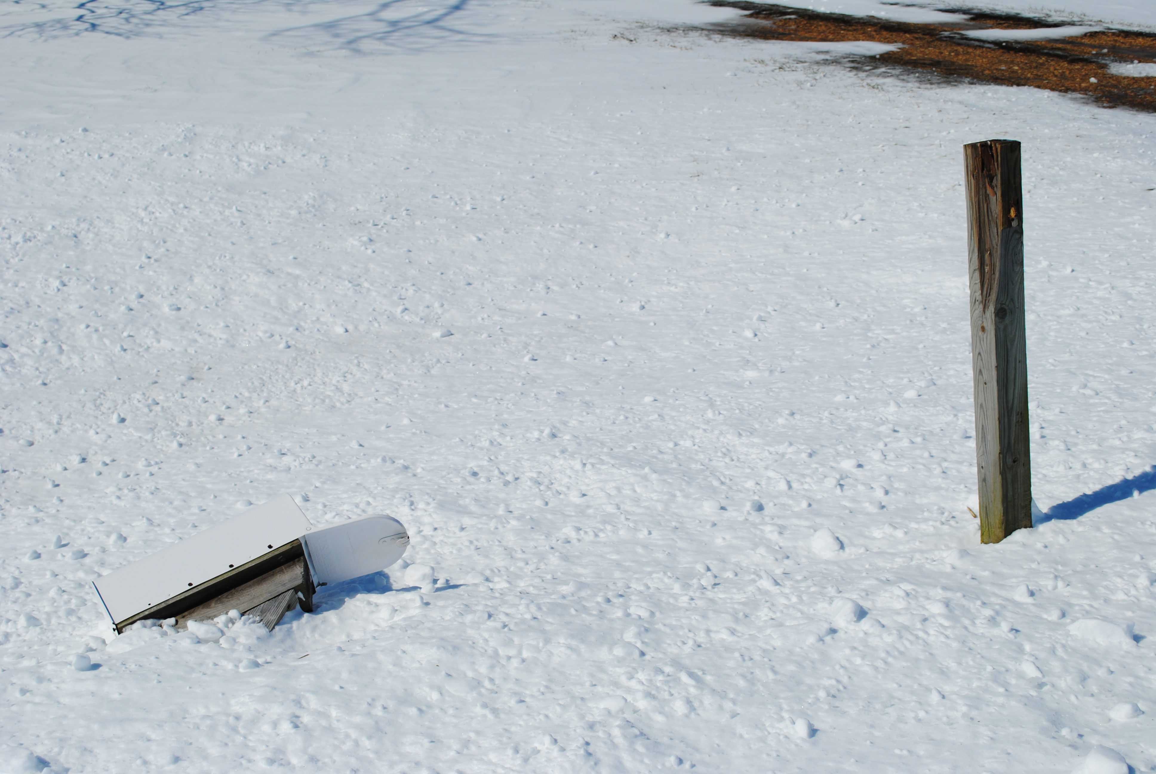 Broken mailbox in the snow