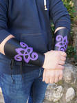 Purple and black cuffs witk triskell by MARIEKECREATION