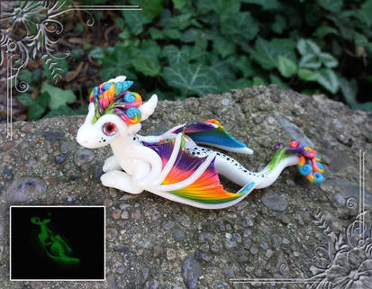 Fully Fluorescent Rainbow Dragon with Red Eyes