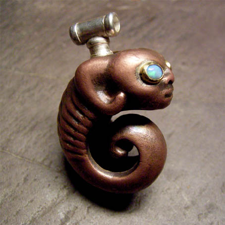 coiled creature pendant