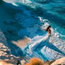 Waves reach softly for the shore.