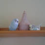 Budgies in love with pottery chicken