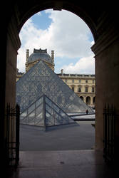 Louvre Pyramids Under an Arch