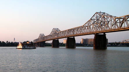 Riverboat passing Bridge