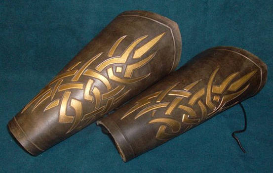 Brow and gold tribal bracer