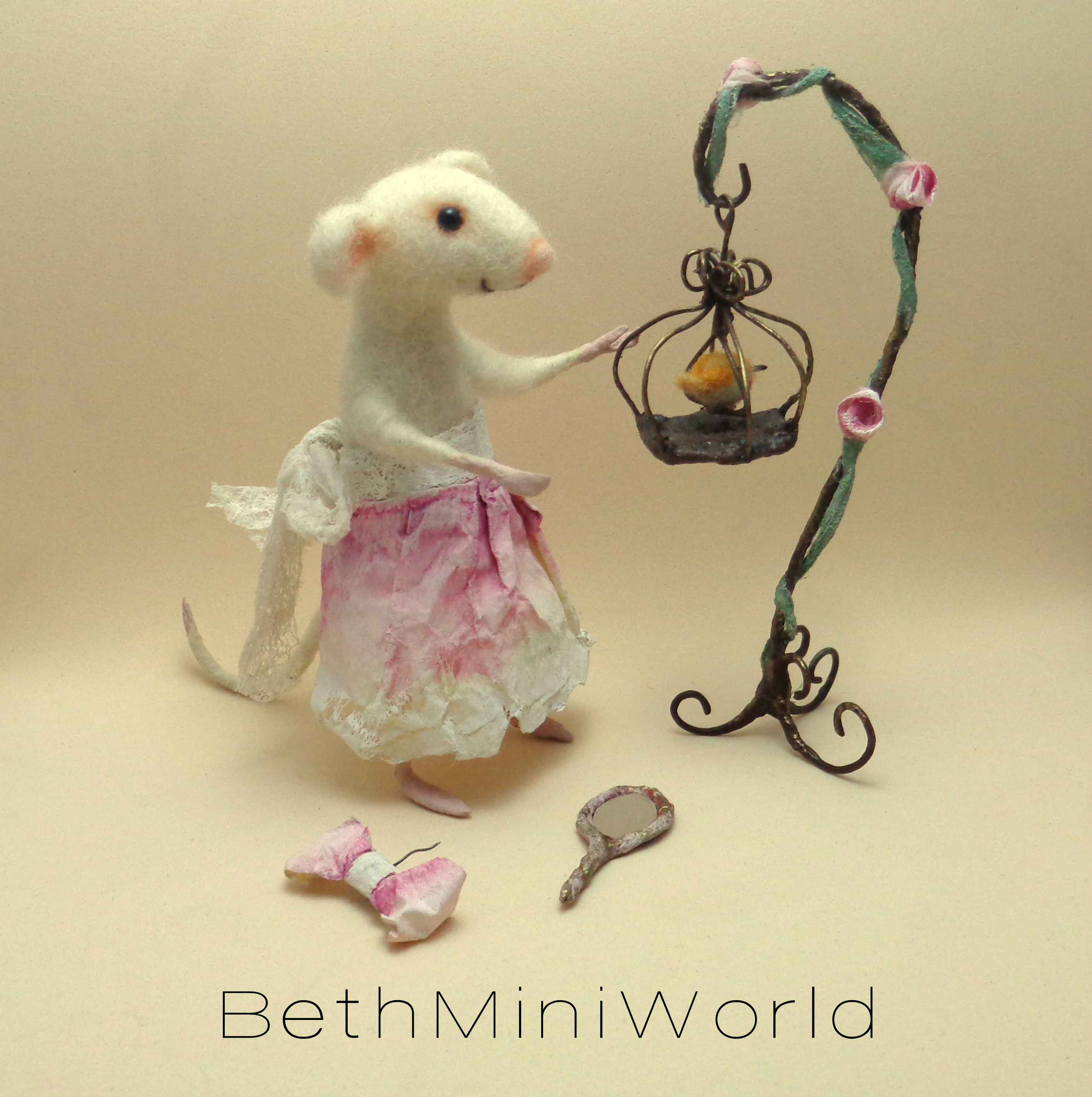 Wire birdcage with needle felted bird