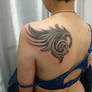wing cover up tattoo 