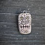 Tribal style tiki mask pendant