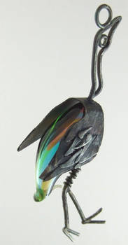 glass and silver bird