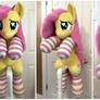 Hugging Fluttershy plush